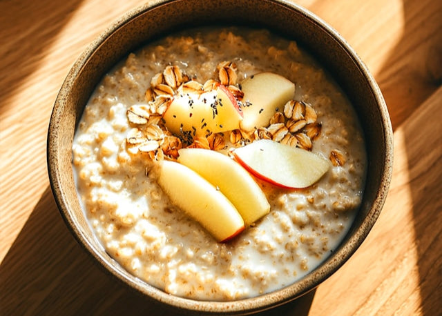 bowl of oats topped with apple slices